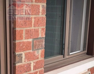Brick repointing around a window in NYC
