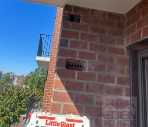 Brick replacement on a building wall in NYC